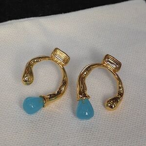 Gold Sculpted Hoop Earrings with Blue Teardrop Accent